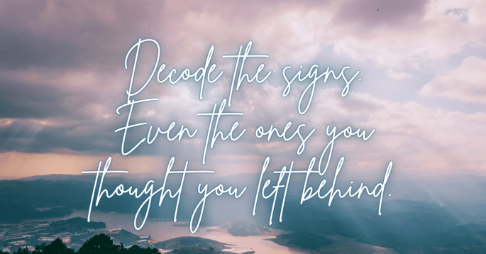 A soft, ethereal sky filled with pink and violet-tinged clouds over a misty valley landscape. Gentle rays of sunlight break through the clouds. The text overlay reads, “Decode the signs. Even the ones you thought you left behind.” The tone is reflective and peaceful.