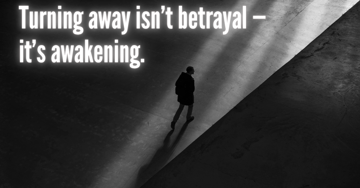 A solitary figure walks through a wide, dimly lit space, illuminated by a diagonal beam of light. The person casts a long shadow and moves away from the light source, symbolizing introspection and change. Overlaid in bold white text: “Turning away isn’t betrayal — it’s awakening.”