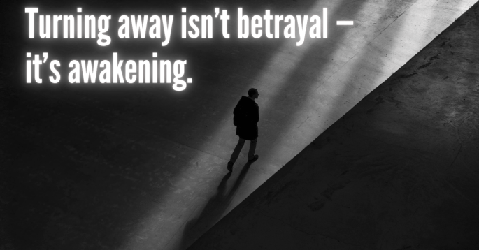 A solitary figure walks through a wide, dimly lit space, illuminated by a diagonal beam of light. The person casts a long shadow and moves away from the light source, symbolizing introspection and change. Overlaid in bold white text: “Turning away isn’t betrayal — it’s awakening.”
