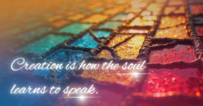 Close-up of stained glass tiles glowing in sunlight, with colors of gold, blue, and crimson melting into one another. Water droplets shimmer on the surface, symbolizing reflection and emotion. The words “Creation is how the soul learns to speak.” appear in elegant white cursive, evoking self-expression, beauty, and spiritual communication.