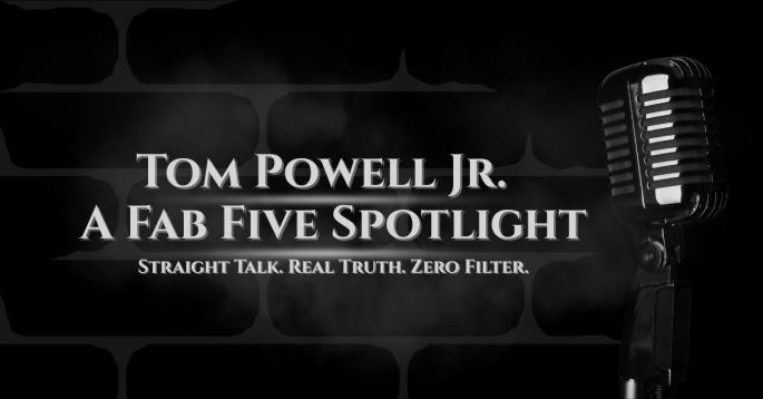 Black-and-white image featuring a vintage microphone against a smoky brick wall background. The bold text reads “Tom Powell Jr. – A Fab Five Spotlight” with the caption “Straight Talk. Real Truth. Zero Filter.” The image evokes raw honesty and unfiltered expression, reflecting the creator’s authentic commentary style.