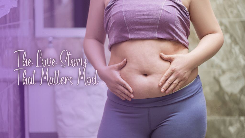 Close-up of a woman gently holding her soft, natural tummy, symbolizing self-love and body acceptance. Soft purple tones and overlay text read: ‘The Love Story That Matters Most.’