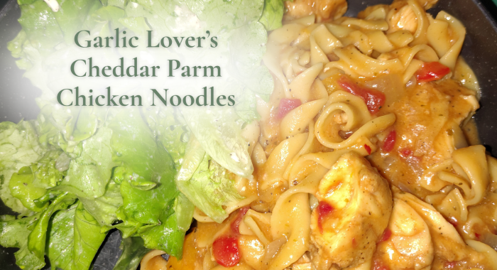 Garlic Lover’s Cheddar Parm Chicken Noodles with creamy egg noodles, chicken, red peppers, and a lemon-feta salad, shown with a soft green title overlay.