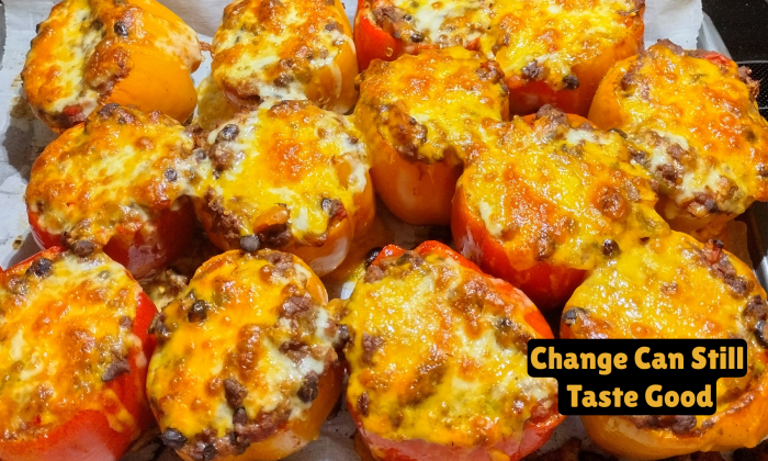 Baked red and orange stuffed peppers topped with melted cheese, with overlay text reading “Change Can Still Taste Good.”
