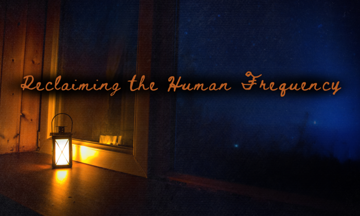 A small lantern glowing warmly on a wooden windowsill at night, casting amber light inside while a deep blue night sky fills the window beyond. The words “Reclaiming the Human Frequency” appear across the image in warm script.