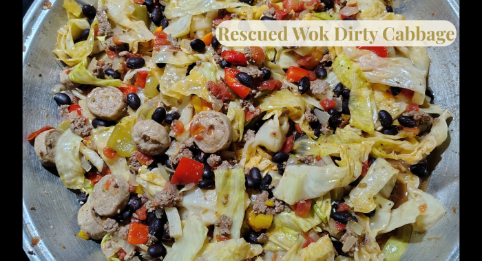 Dirty Cabbage in the Rescued Wok with cabbage, black beans, diced tomatoes, bell peppers, extra-lean beef, and sliced chicken sausage, shown with an overlay reading “Rescued Wok Dirty Cabbage.”