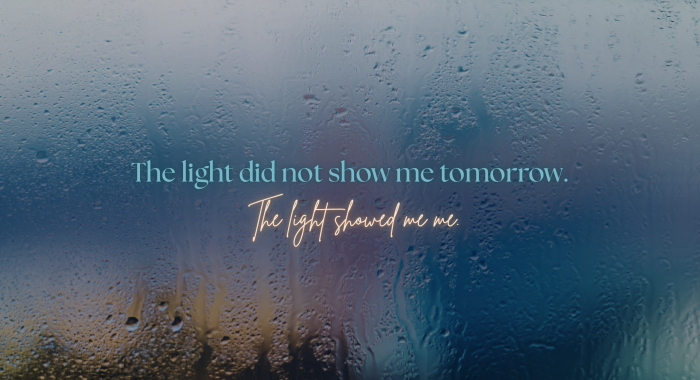 Rain-covered window with soft light visible through the condensation, symbolizing uncertainty, reflection, and the difference between meaning and prediction.