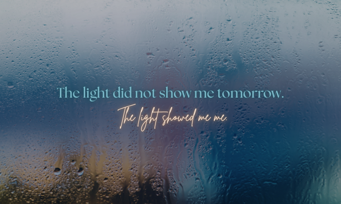 Rain-covered window with soft light visible through the condensation, symbolizing uncertainty, reflection, and the difference between meaning and prediction.