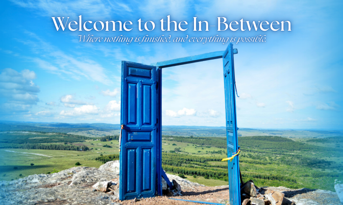 An open blue door standing alone in a wide landscape under a bright sky, symbolizing transition and possibility.