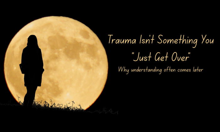 Silhouette of a person standing in front of a full moon at night with the words “Trauma Isn’t Something You Just Get Over” and the subtitle “Why understanding often comes later.”
